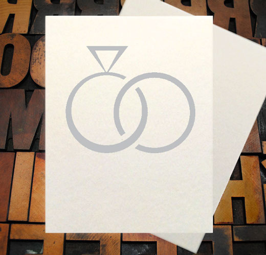 Letterpress Card with the text, "I -heart shape- you more than bacon" over an image of a strip of bacon