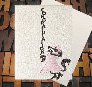 Letterpress Card with an image of a dog in a pink dress with the text, "Congratulations!"