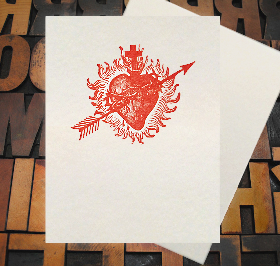 Letterpress Card with an image of a bleeding heart, with arrow, cross, and flames