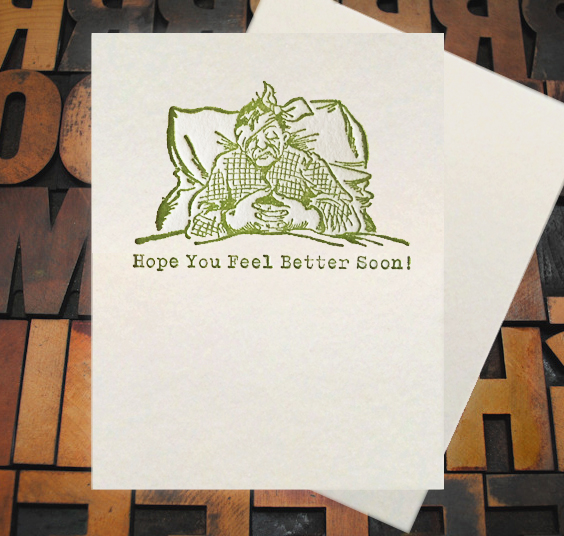 Letterpress Card with an image of a sick man in bed with the text, "Hope you feel better soon!"