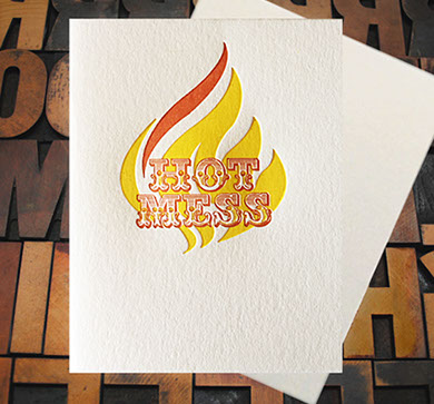Letterpress Card with the words "Hot Mess" over top of a styleized flame