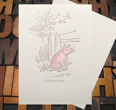 Letterpress Card with an image of a pig sitting near a fence with the text, "I miss you"