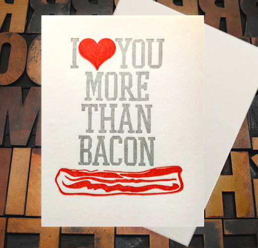 Letterpress Card with the text, "I -heart shape- you more than bacon" over an image of a strip of bacon