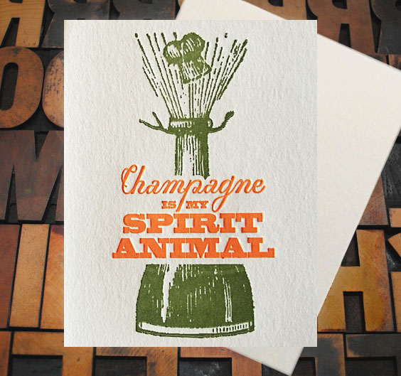 Letterpress Card with a bottle of champagne popping and the text, "Champagne is my spirit animal"