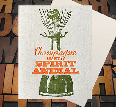 Letterpress Card with a bottle of champagne popping and the text, "Champagne is my spirit animal"