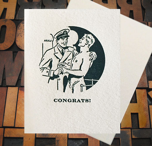 Letterpress Card with an image of an officer and a topless gentleman embracing over the text, "Congrats!"