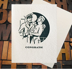 Letterpress Card with an image of an officer and a topless gentleman embracing over the text, "Congrats!"