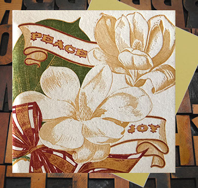 Letterpress Card with ribbons, Magnolia blossoms, and the text, "Peace & Joy"