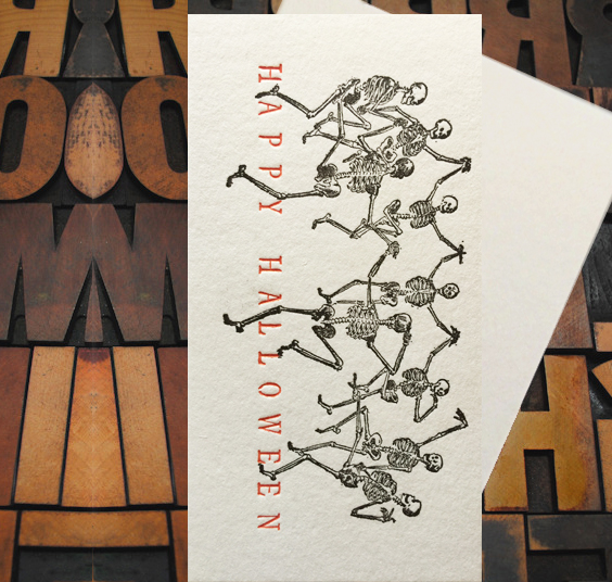 Letterpress Card with several dancing skeletons and the text, "Happy Halloween"