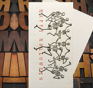Letterpress Card with several dancing skeletons and the text, "Happy Halloween"