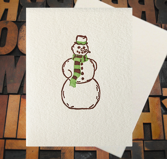 Letterpress Card with an image of a snowman with a green scarf and hat ribbon