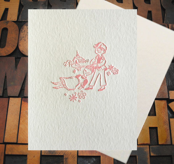 Letterpress Card with an image of a young man dragging an unconcious, yet smiling, woman by the hair towards a chapel