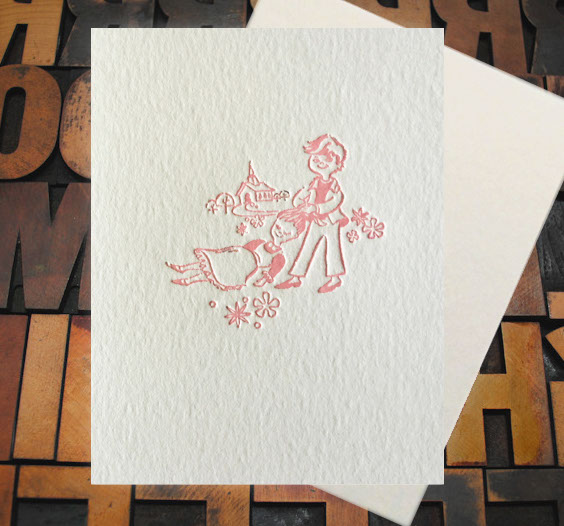 Letterpress Card with an image of a young man dragging an unconcious, yet smiling, woman by the hair towards a chapel