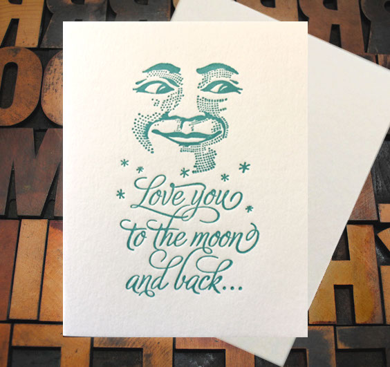 Letterpress Card with an image of the moon's face above the text, "I love you to the moon and bck..."