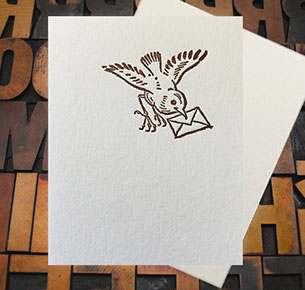 Letterpress Card with an image of a black bird holding a letter in its beak