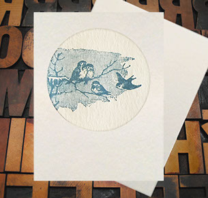 Letterpress Card with an image of blue birds sitting on a branch in the winter