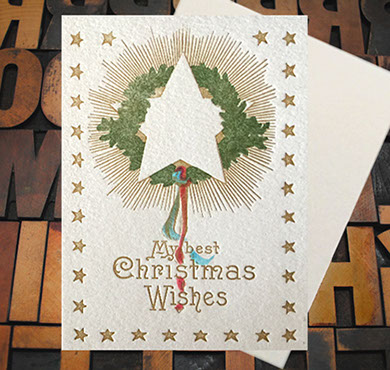 Letterpress Card with the text, "My best Christmas Wishes" and star, greenery, ribbon imagery