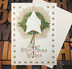 Letterpress Card with the text, "My best Christmas Wishes" and star, greenery, ribbon imagery